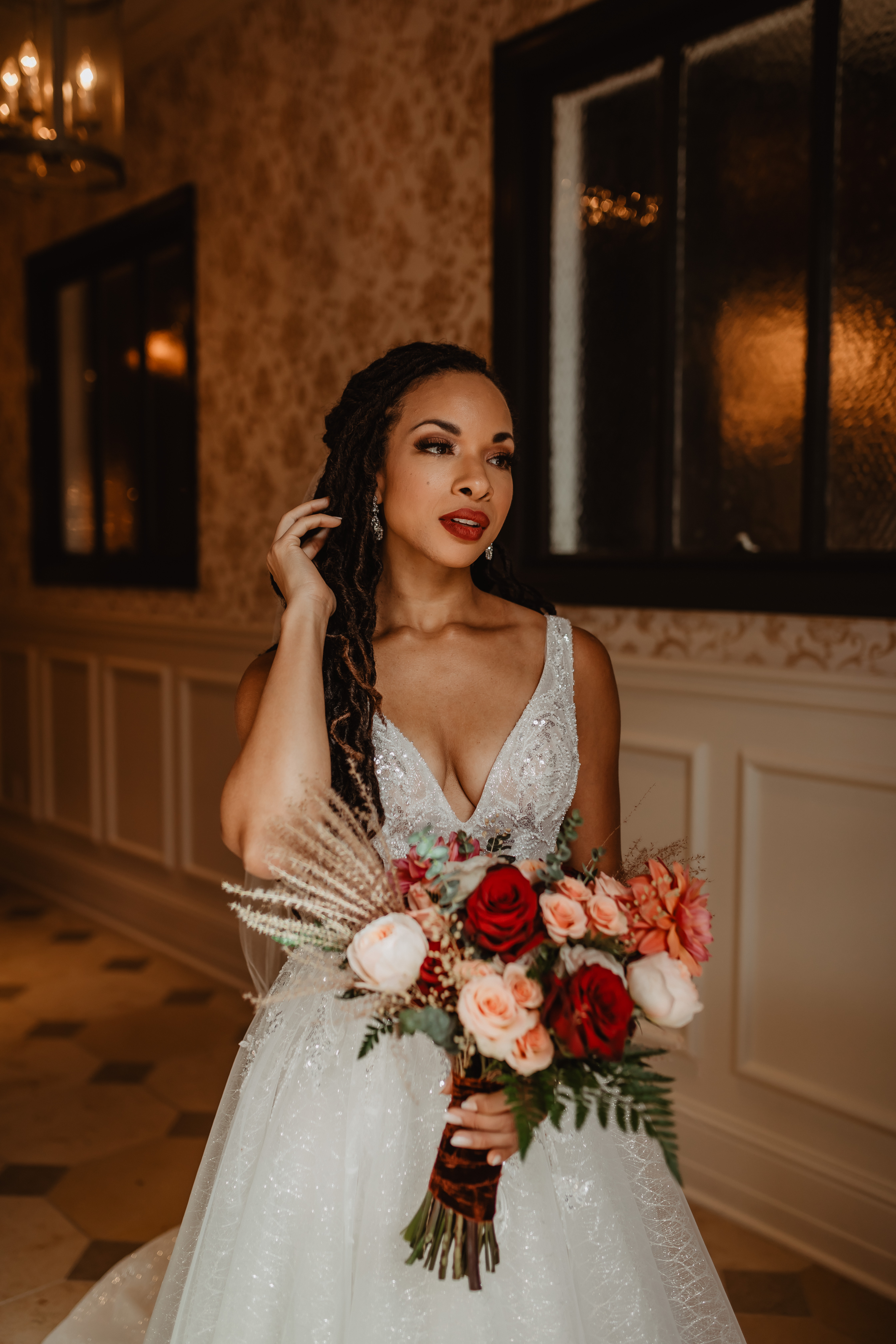 Bride posing for portraits indoors at Olympic Rooftop Pavilion before the wedding.