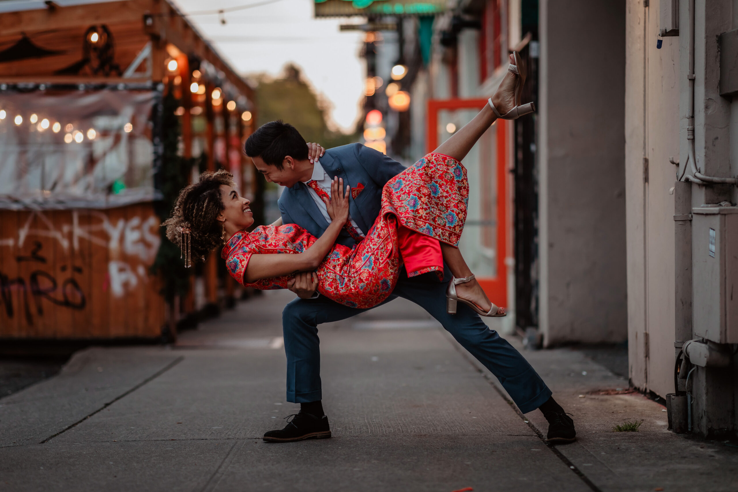 Man dipping woman in cheongsam in Capitol Hill